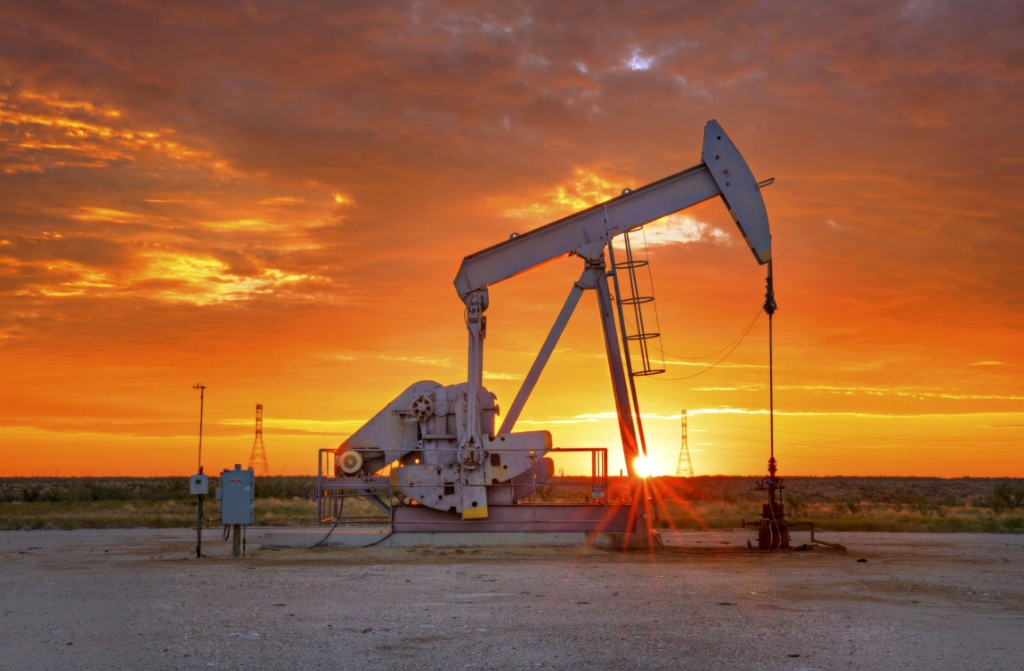 Active pumpjack at sunset