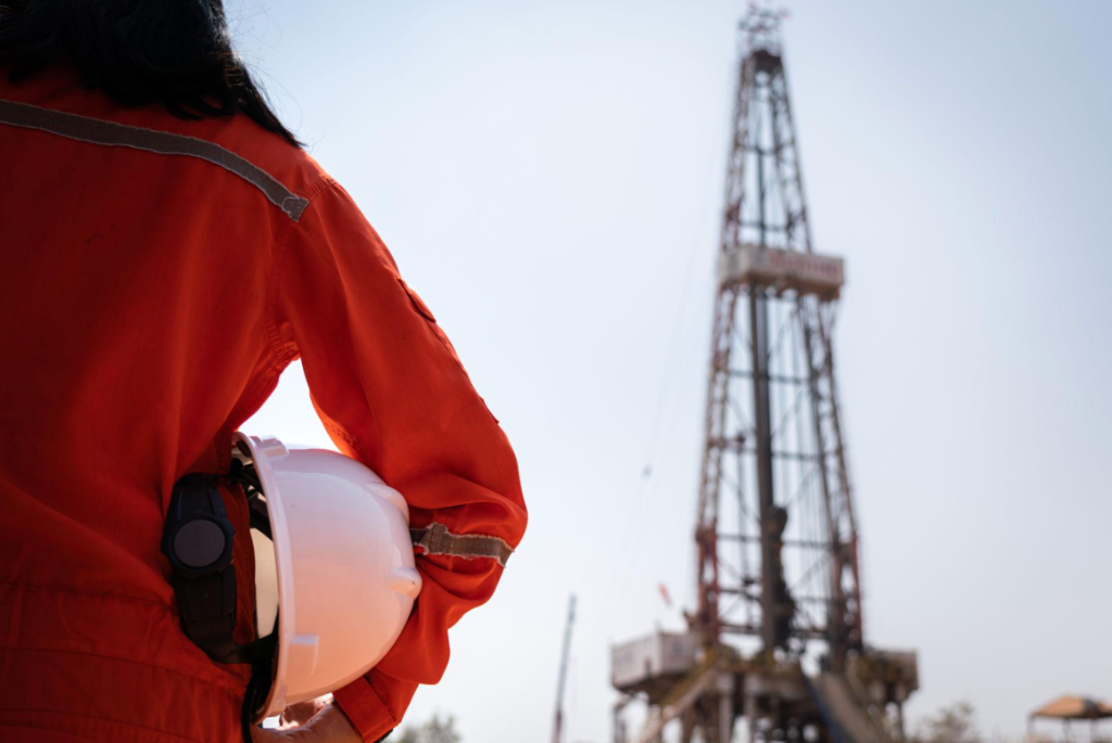 Energy Worker looking at Rig